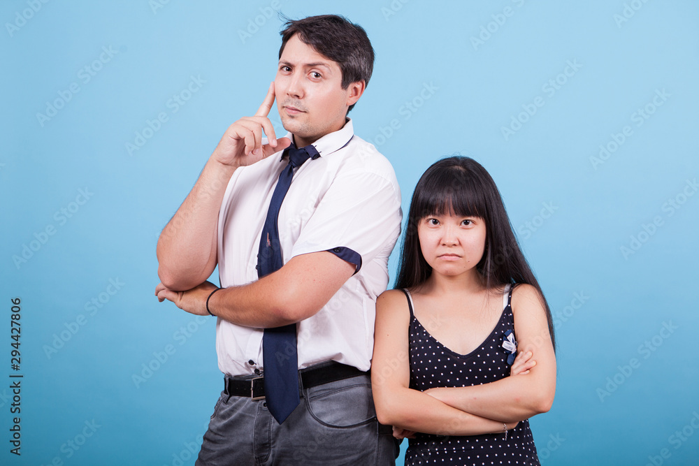 Naklejka premium Portrait of serious interracial couple looking at the camera