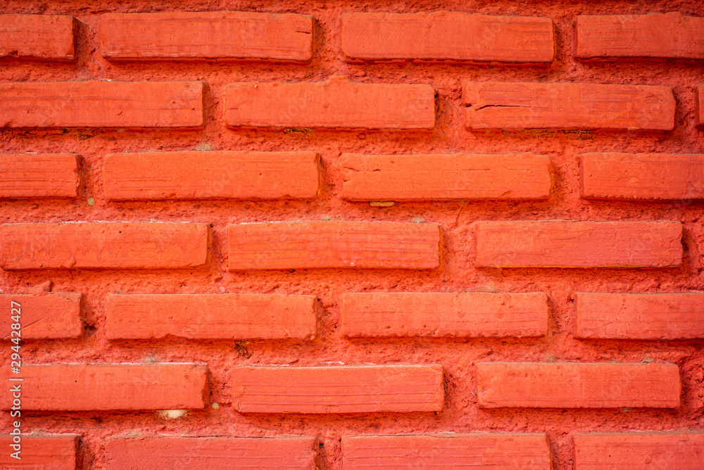 Fototapeta premium Brick wall painted with bright red for making the background
