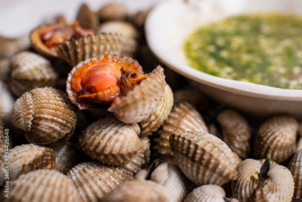 Scalding clams are appetizing red with a spicy sauce. Scalding clams are appetizing red with a spicy sauce.