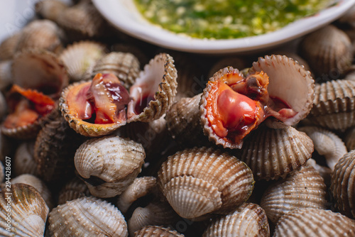 Scalding clams are appetizing red with a delicious spicy sauce.