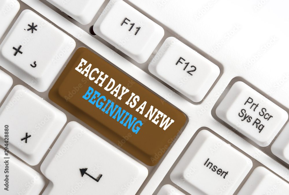 Writing note showing Each Day Is A New Beginning. Business concept for Every morning you can start again Inspiration White pc keyboard with note paper above the white background Writing note showing Each Day Is A New Beginning. Business concept for Every morning you can start again Inspiration White pc keyboard with note paper above the white background