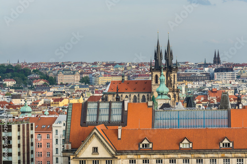 Aerial view of citycape of old town of Prague, with a lot of red rooftops and The Church of Mother of God before Týn. A gothic church and a dominant feature of the Old Town. View from the Letna park.