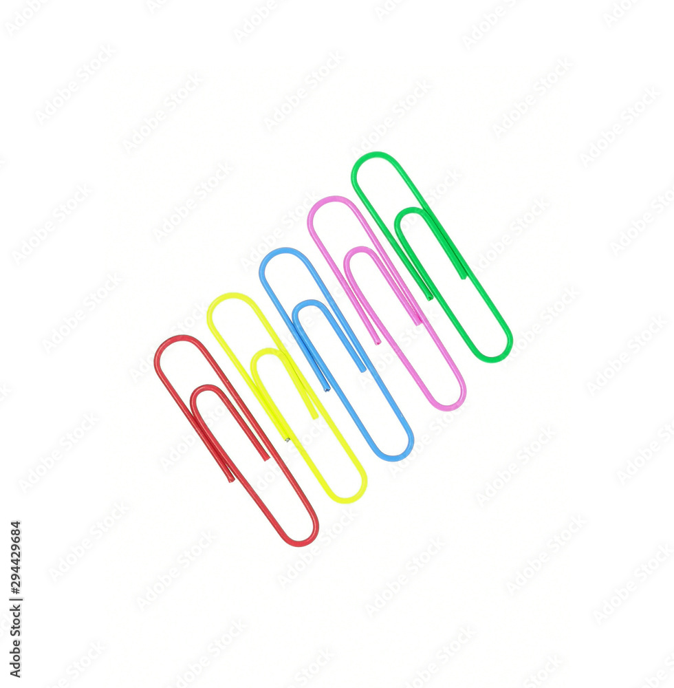 Series of colorful paper clips isolated on a white background. Decorative paper clips in pink, yellow, green, red and blue colors Series of colorful paper clips isolated on a white background. Decorative paper clips in pink, yellow, green, red and blue colors