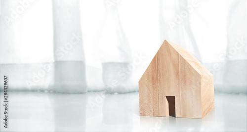 Wooden House Model on wooden there space.Home,Housing Real Estate concept photo