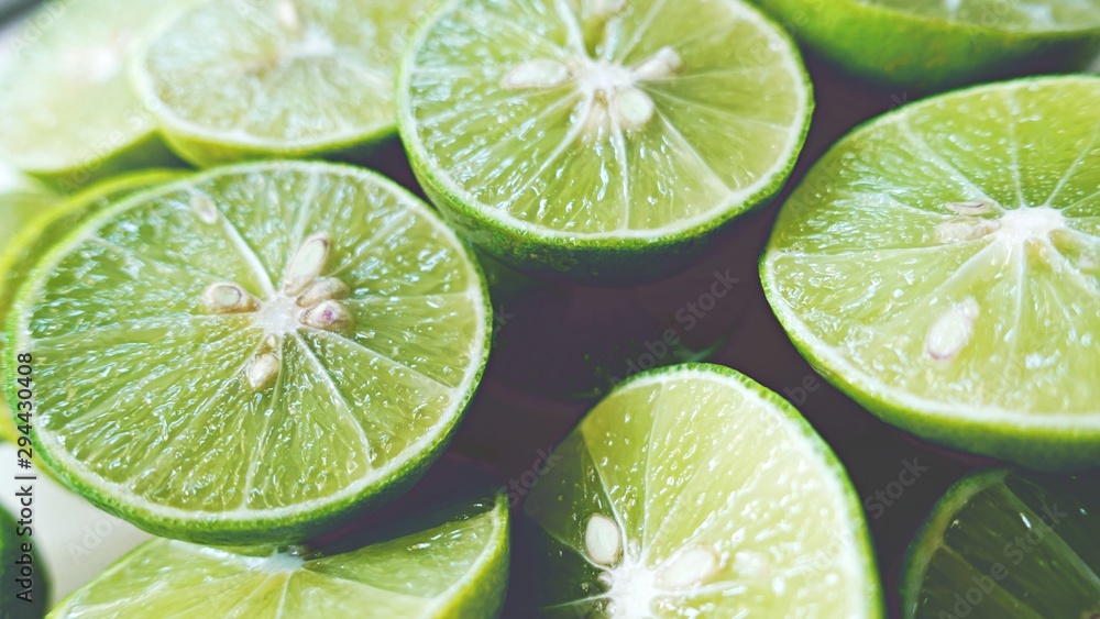 Lime Background. Close up shot of limes. Selective Focus of sliced lime. Lime Background. Close up shot of limes. Selective Focus of sliced lime.