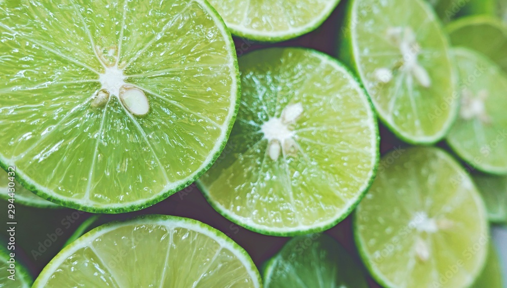 Lime Background. Close up shot of limes. Selective Focus of sliced lime. Lime Background. Close up shot of limes. Selective Focus of sliced lime.