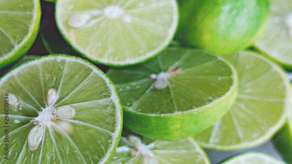 Lime Background. Close up shot of limes. Selective Focus of sliced lime. Lime Background. Close up shot of limes. Selective Focus of sliced lime.