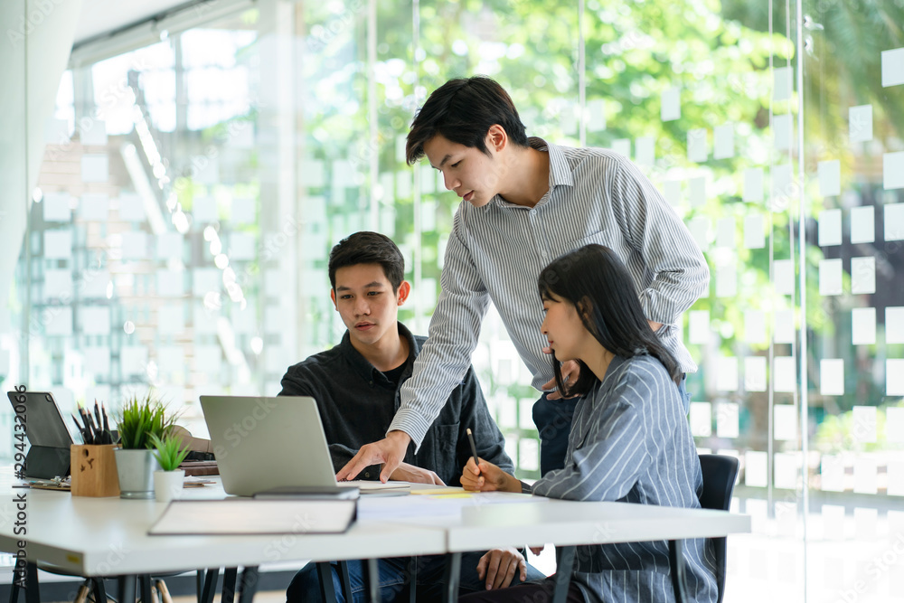 Young business team discussing together in conference room during meeting at office. Teamwork and power successful meeting workplace concept. Young business team discussing together in conference room during meeting at office. Teamwork and power successful meeting workplace concept.