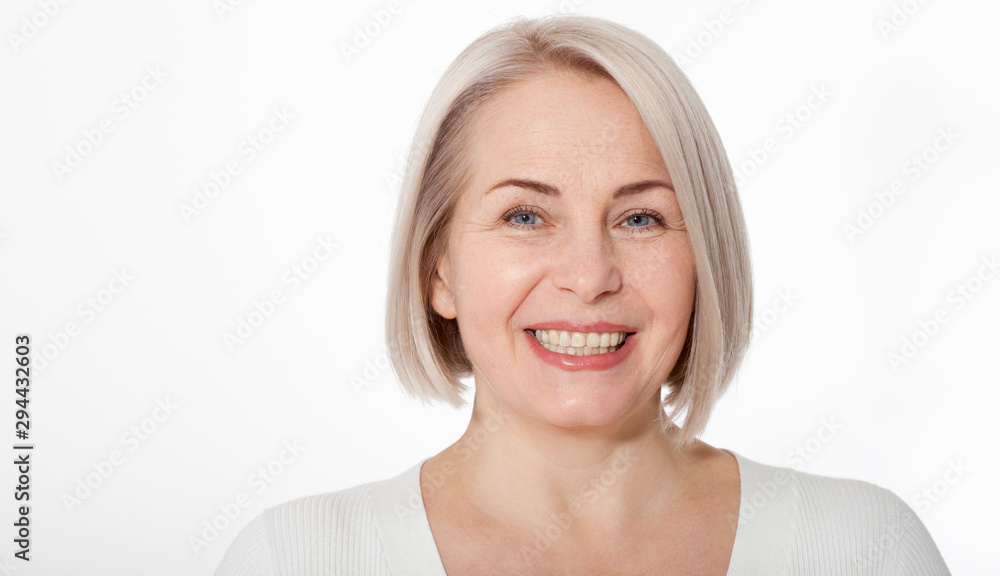 Happy woman emotionally posing in a studio. Happy woman in yellow bright sweater on white background Happy woman emotionally posing in a studio. Happy woman in yellow bright sweater on white background