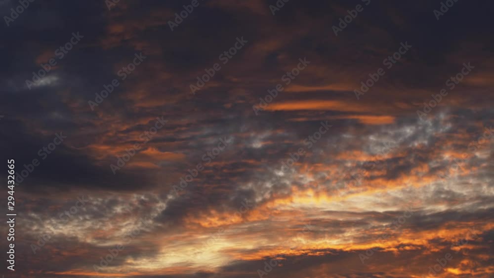 Timelapse from sunset with dramatic clouds Warm orange and cold blue colors is playing at top of the skies Timelapse from sunset with dramatic clouds Warm orange and cold blue colors is playing at top of the skies