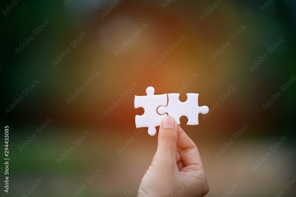 Hands and puzzles, important pieces of teamwork Teamwork concept Hands and puzzles, important pieces of teamwork Teamwork concept