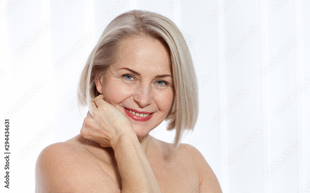 Beauty Woman with perfect skin Portrait. Beautiful middle-aged blonde woman shows off her perfectly well-groomed face. Plastic surgery and collagen injections. Macro face. Realistic images Beauty Woman with perfect skin Portrait. Beautiful middle-aged blonde woman shows off her perfectly well-groomed face. Plastic surgery and collagen injections. Macro face. Realistic images