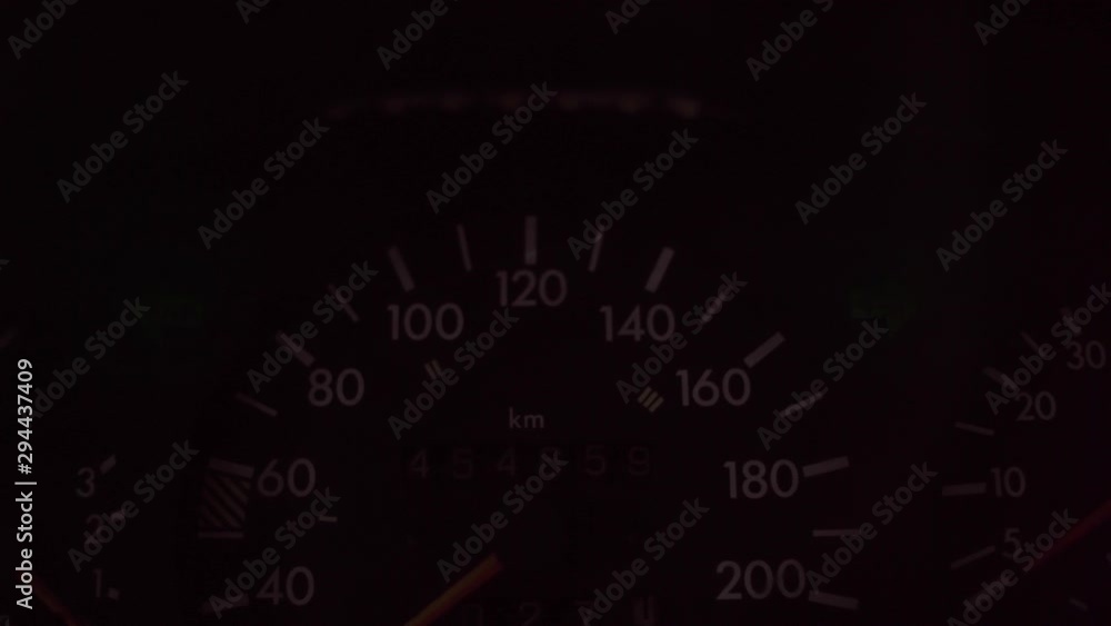 turn signal control light in car dashboard. an alarm signal on instrument panel at night. turn signal control light in car dashboard. an alarm signal on instrument panel at night.