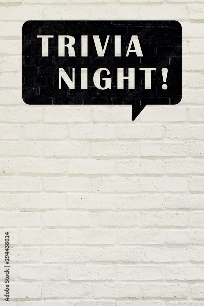 Obraz premium 白い煉瓦の壁に TRIVIA NIGHT! の文字