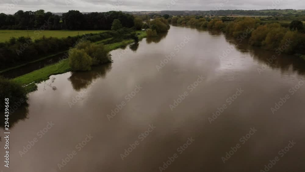 Drone flight over River Trent bridge and calm still fresh water beautiful scenic floodplain landscape Drone flight over River Trent bridge and calm still fresh water beautiful scenic floodplain landscape