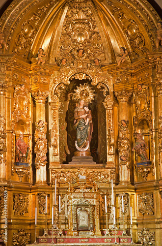 MADRID - MARCH 10: Madonna and baroque altar of Capilla del Sanctisimo from church San Isidoro on March 10, 2013 in Madrid.