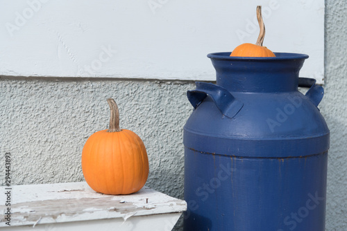 Contemporary Minimal Vintage Autumn Decor Scene. Pumpkins Metal Milk Jug Fall Season Copy Space © Vlad