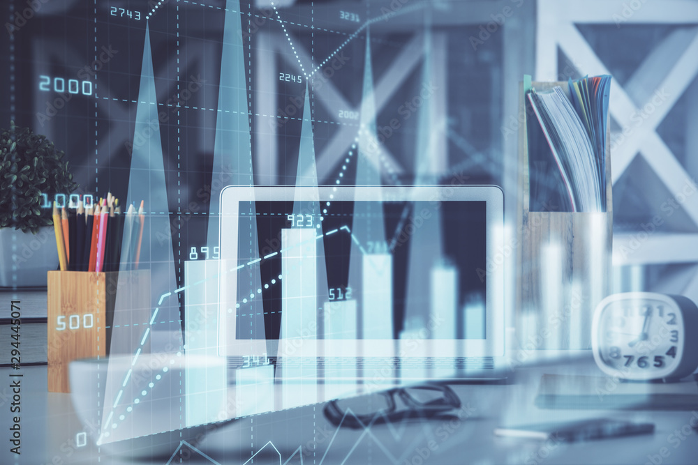 Stock market chart hologram drawn on personal computer background. Double exposure. Concept of investment. Stock market chart hologram drawn on personal computer background. Double exposure. Concept of investment.