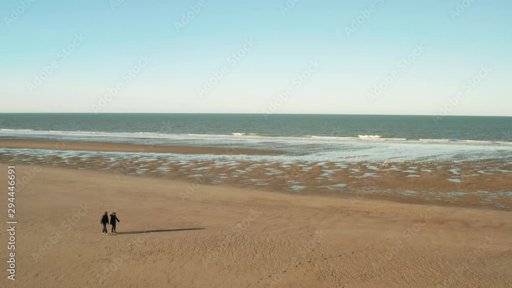 Dunkirk beach, two people and seagulls (Dunkerque, France) Dunkirk beach, two people and seagulls (Dunkerque, France)