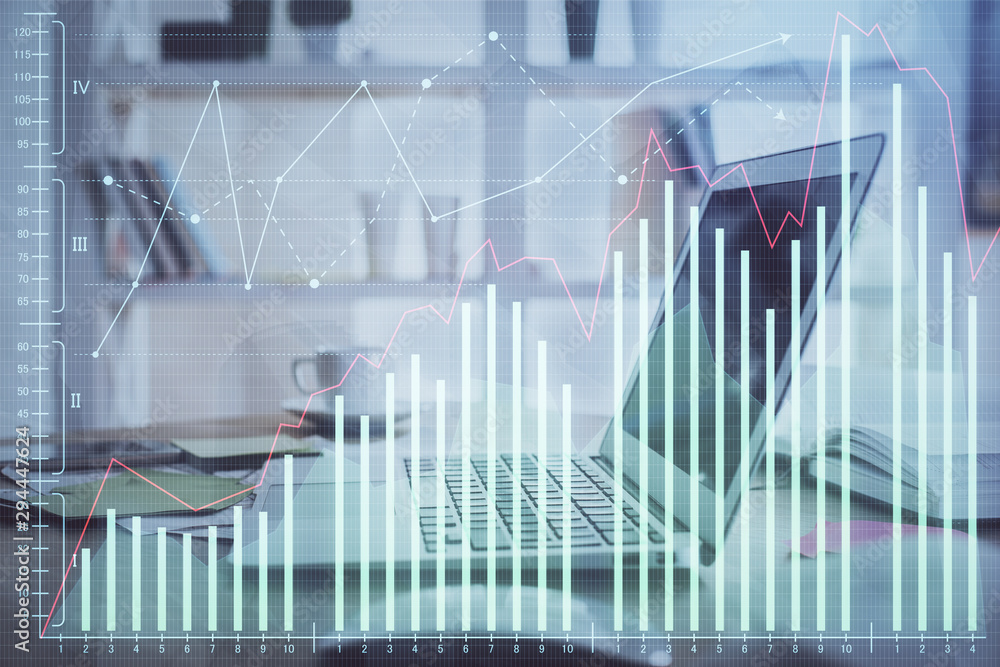 Financial graph colorful drawing and table with computer on background. Multi exposure. Concept of international markets. Financial graph colorful drawing and table with computer on background. Multi exposure. Concept of international markets.