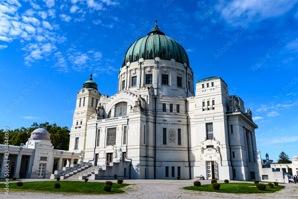St. Charles Borromeo Cemetery Church with blue sky and clouds in Vienna Central Cemetery in Austria