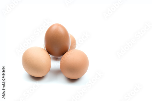 Four brown eggs separated from the white background with spaces for writing text.