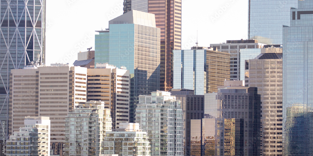 Close up view of skyrise office and apartment buildings in Calgary, modern glass architecture