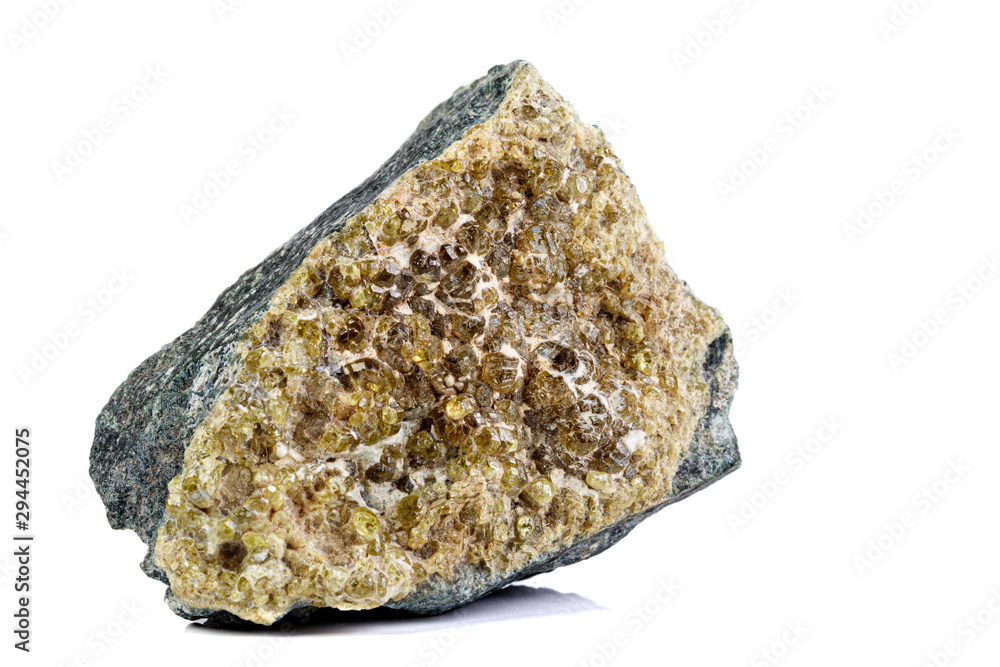 macro mineral stone grossular on a white background macro mineral stone grossular on a white background