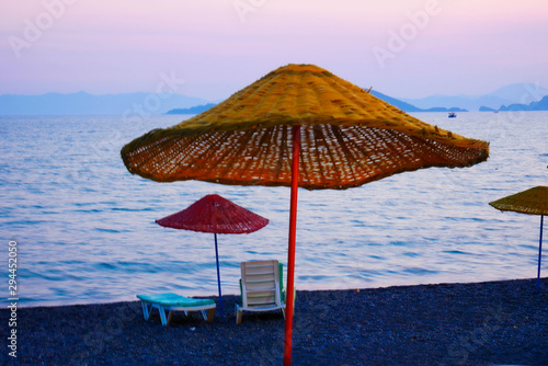 beach umbrella sunrise sea sky 