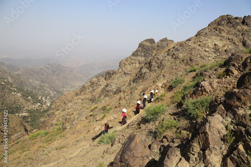 Yemeni women bring their food and drink needs across rugged mountain roads due to the war and the blockade in Yemen