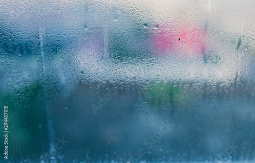Moist on wet window. Window glass with high air humidity. Background of natural water condensation. High level of dampness in apartment
