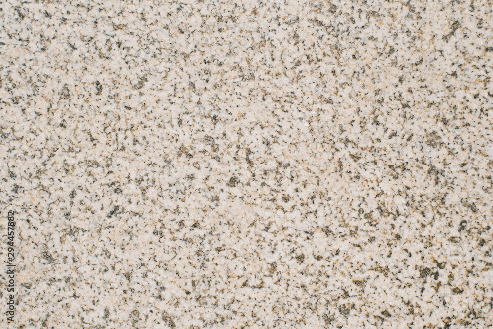 Light beige granite, granite chips background Light beige granite, granite chips background