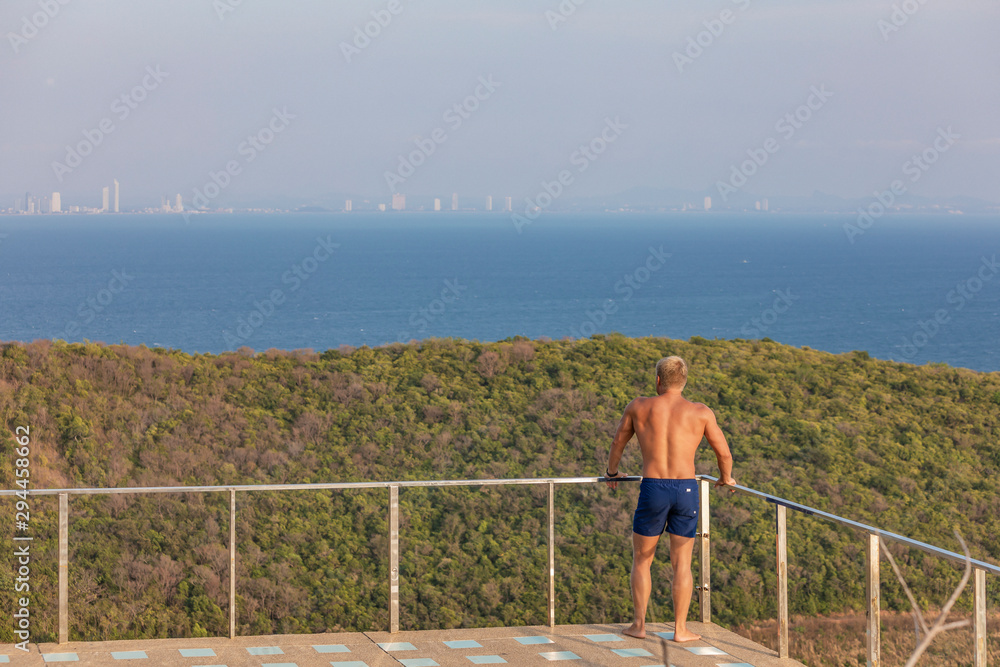 man on the observation deck of the island