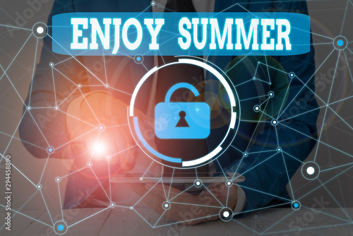 Text sign showing Enjoy Summer. Business photo showcasing taking a break from school and spending holidays in the beach Male human wear formal work suit presenting presentation using smart device