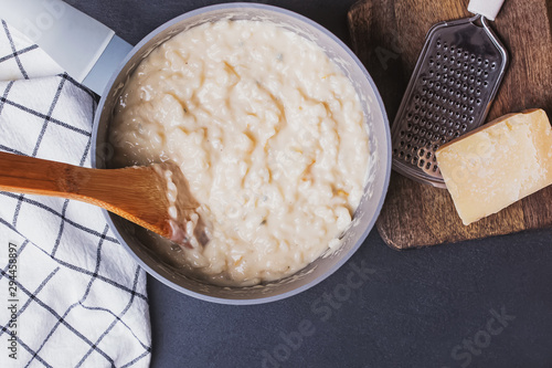 Delicious italian risotto with cheese in a pot