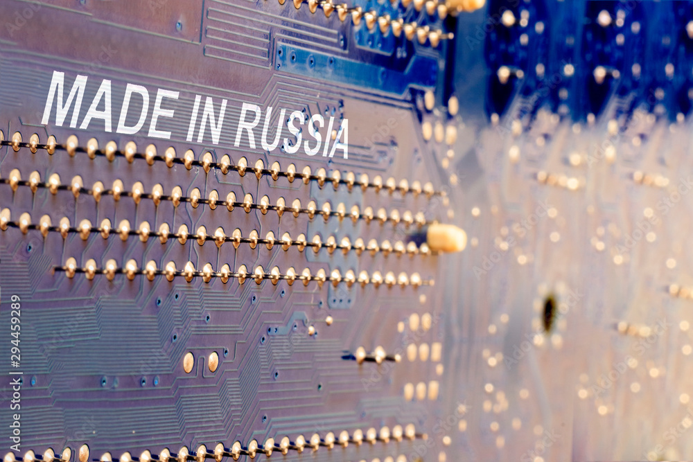 close-up. motherboard in blue. the inscription is made in Russia. close-up. motherboard in blue. the inscription is made in Russia.