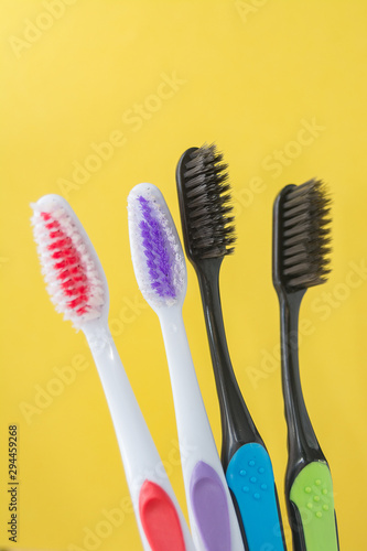 toothbrushes are multicolored on a bright colored background close-up