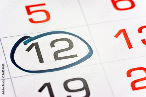 the twelfth day of the month highlighted on the calendar with a frame close-up macro, the mark on the calendar, the twelfth date