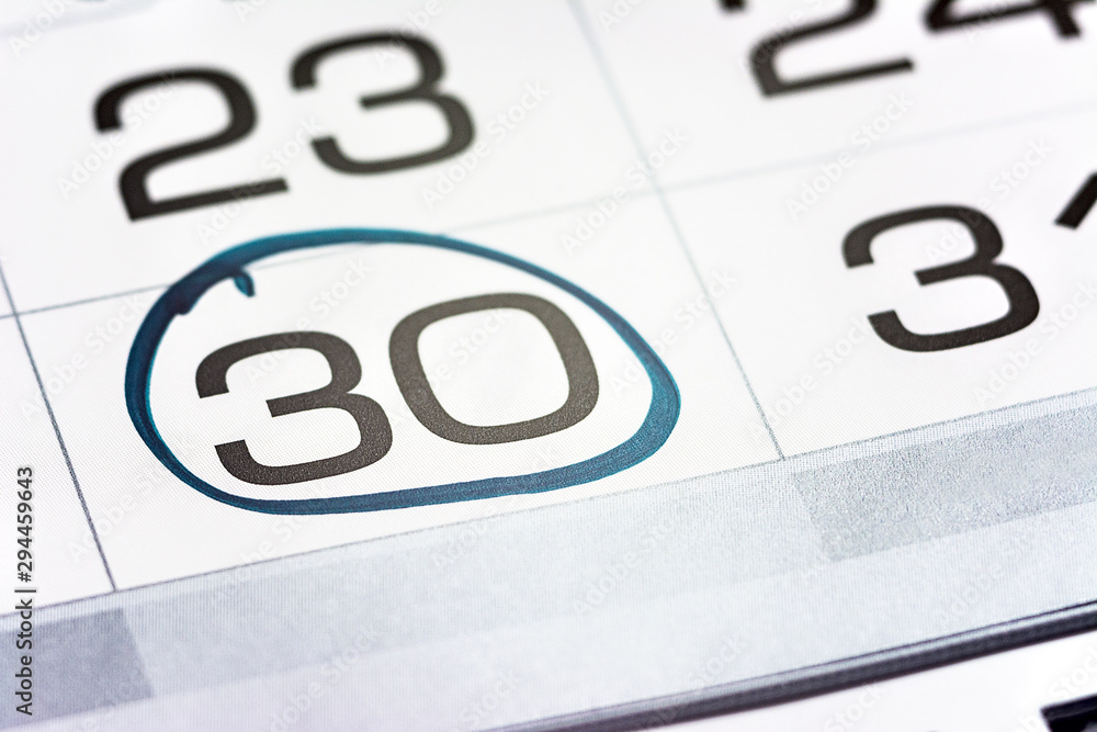 the thirtieth day of the month highlighted on the calendar close-up macro, the mark on the calendar, the thirtieth date the thirtieth day of the month highlighted on the calendar close-up macro, the mark on the calendar, the thirtieth date