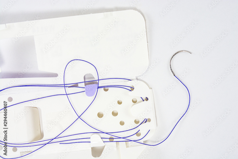 suture material close-up, thread for suturing wounds in medicine, dentistry, medical needle suture material close-up, thread for suturing wounds in medicine, dentistry, medical needle