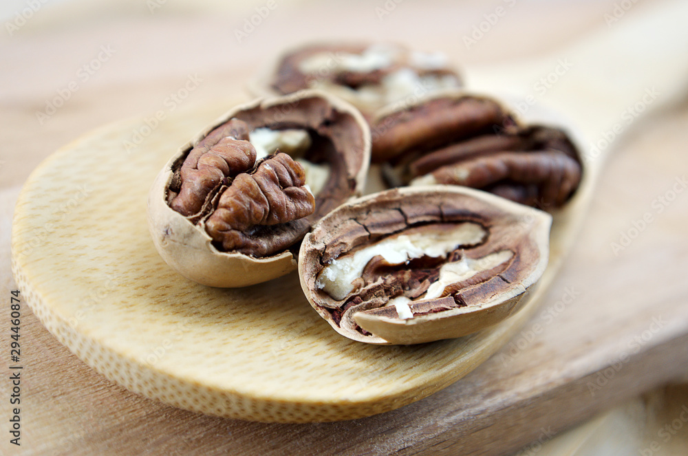 pecan close-up macro high resolution on wooden background pecan close-up macro high resolution on wooden background