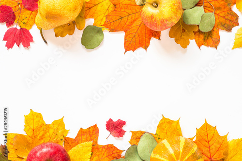 Autumn flat lay background with leaves and harvest on white.