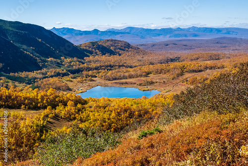 lake on a background of yellow autumn mountains