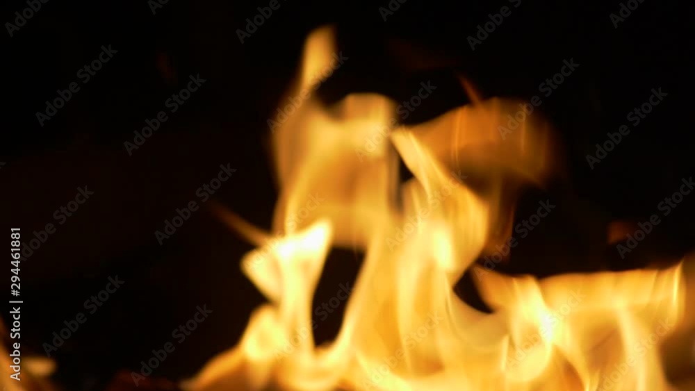 Real fire flames on black background. Burning fire. Slow motion shot Real fire flames on black background. Burning fire. Slow motion shot