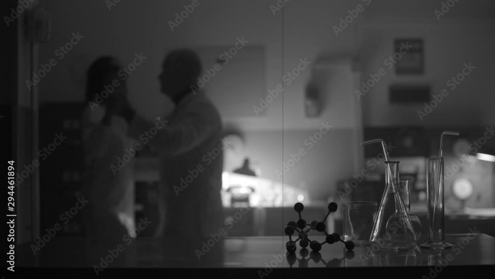 Scientists dancing together in the laboratory Scientists dancing together in the laboratory