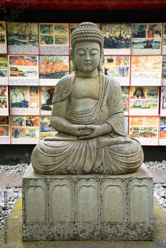 Portrait of the historical and idealized Buddha, carved from a stone