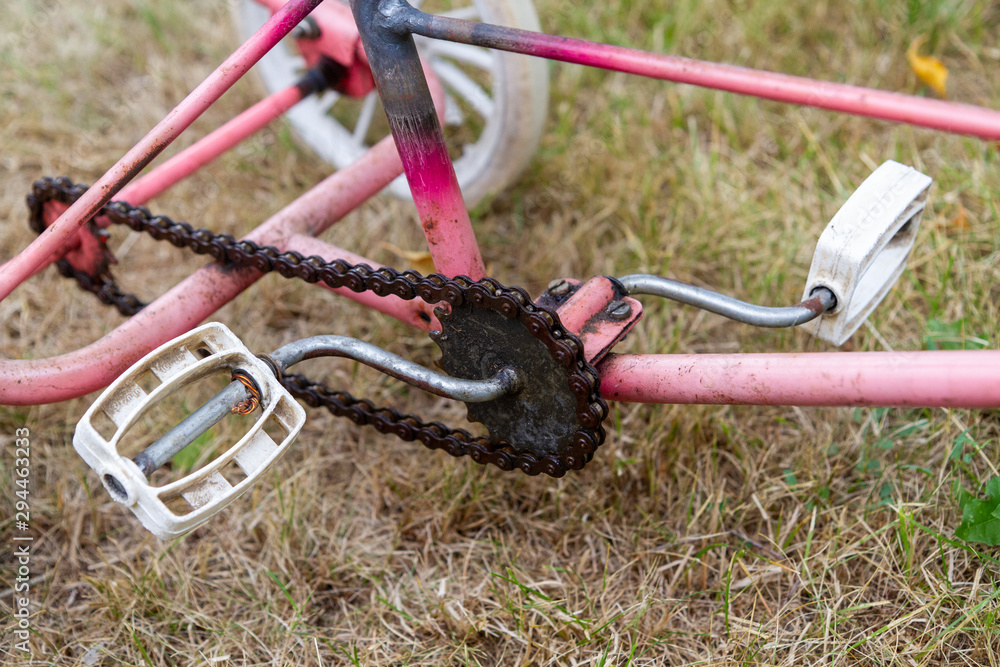 a crankset of an old tricycle for children