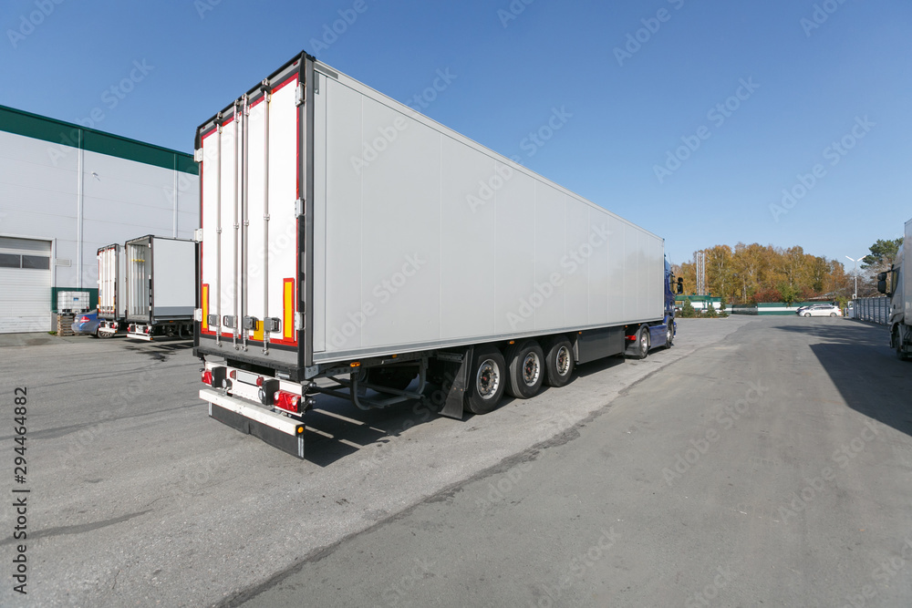 blue truck with white trailer