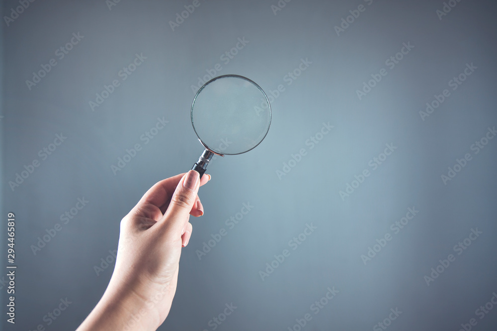 woman hand magnifier woman hand magnifier
