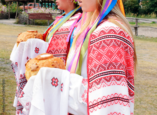 Ukrainians in national dress are greeted with bread and salt